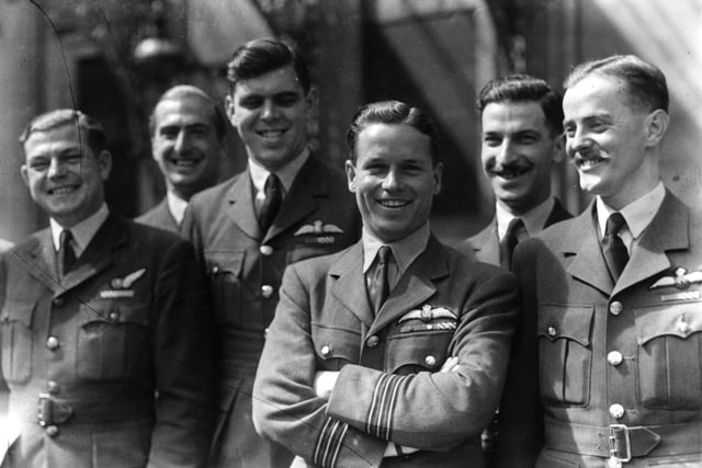 L-R; Flight Lieutenant Richard Roper AJ-G,Flying Officer Frederick Spafford AJ-G,Flight Lieutenant David Maltby AJ-J, Wing Commander Guy Gibson VC  (1918-1944),Flight Lieutenant Edward Johnson AJ-N and Flight Lieutenant Harold Martin AJ-P of No 617 (Dambusters )Squadron, Royal Air Force Bomber Command attend an investiture with other members of the squadron at Buckingham Palace in London on 22nd June 1943. Gibson led the famous 'Dambusters' raid on the Moehne and Eder dams in the Hesse region of Germany on 16th-17th May 1943.The letter codes following each name denote those of the AVRO Lancaster Mk.IIIs Type 464 bomber aircraft they flew on the Dambuster raid. (Photo by Keystone/Getty Images)