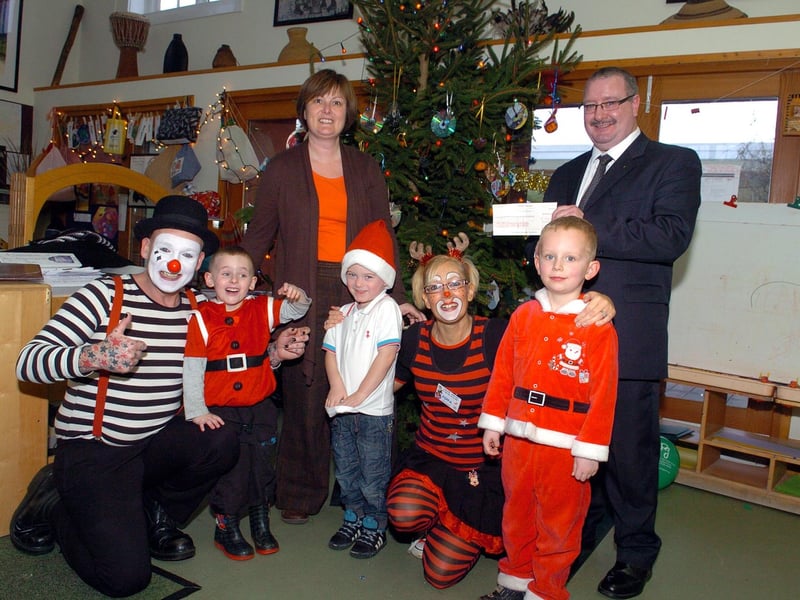 Masonic Lodge of Unity, Corby, provided £750 for Christmas parties for the nursery children in 2011. Pictured are deputy head Angela Prodger, George Peel from Unity Lodge with Mr Mudge and Pippa and children.