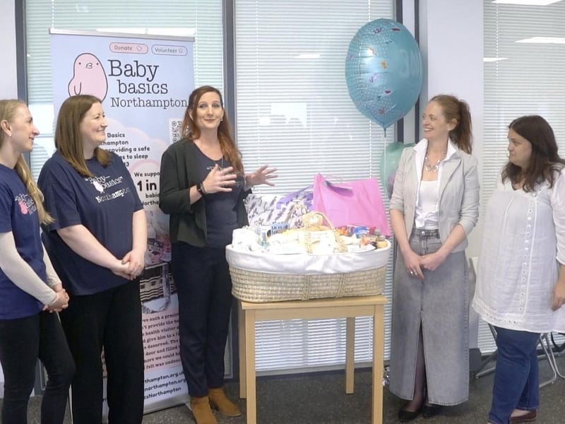 Baby Basics Northampton team presenting 3000th starter pack to Louise and Nicole from Growing Together