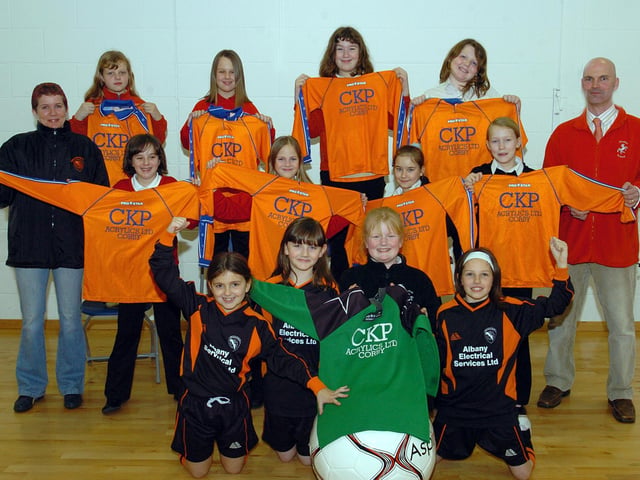 Corby, Studfall Junior School ,presentation of football kit  l-r Lauran Dempsey,.Rhiann Coleman, Aimee Hipkiss,, Aimee Burlington,, Sheila Lauder ,Manager of U10 Cougars team and  team coach at Studfall Junior, Stuart Aves, -  March 2006