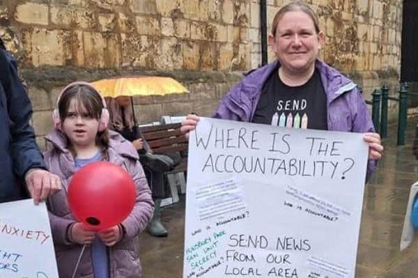 Julie with her children campaigning.