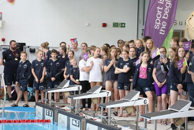 Swimmers watch the ceremony at Corby pool