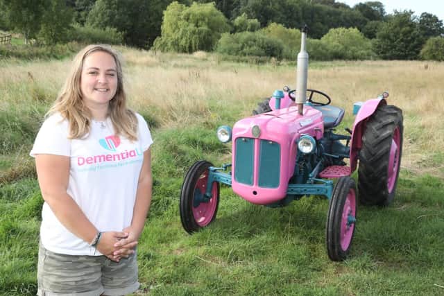 Anna Griffiths with her pink Fordson Dexta tractor