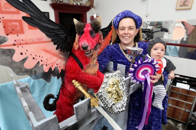 RUSHDEN. Su Eld-Weaver of It's A Dog's Life who won Creative Groomer of the Year at the English Grooming Championships. Pictured with eight week old Quinn Eld - Weaver and standard poodle Denni recreating the taming of the Dragon.
 June 2010
: