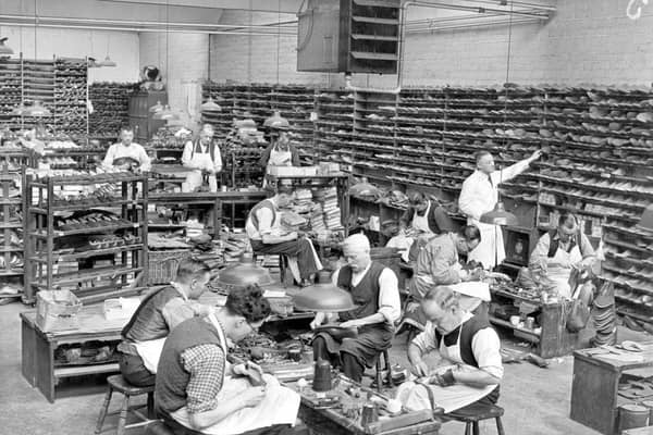 Shoemakers at work in the hand-sewing room helping with post-war trade at Sticklands, Northampton around 1950.