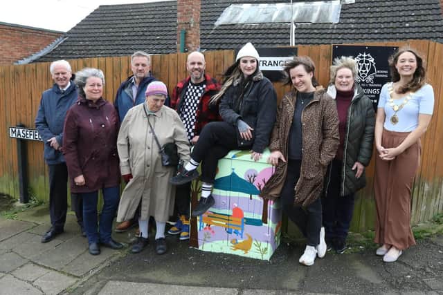 The three artists with one of the BT Openreach boxes in Masefield Road with town councillors and Mayor of Kettering Cllr Emily Fedorowycz /National World