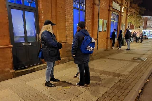 Kettering Street Pastors checking on a woman when we joined them for a shift in 2021