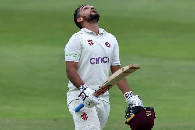 Saif Zaib shows his relief after completing his century against Surrey at the County Ground