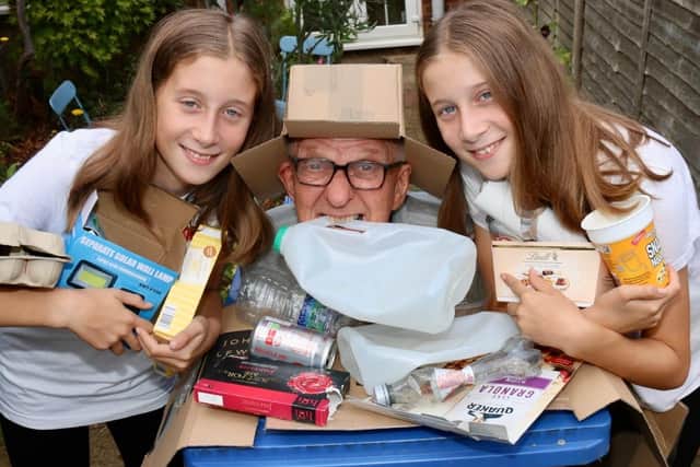 Recycled teenager Mick Smith, with eleven year old twins Ruby and Amelie, preparing for the Broughton village show, with the theme this year recycling. Picture Kit Mallin