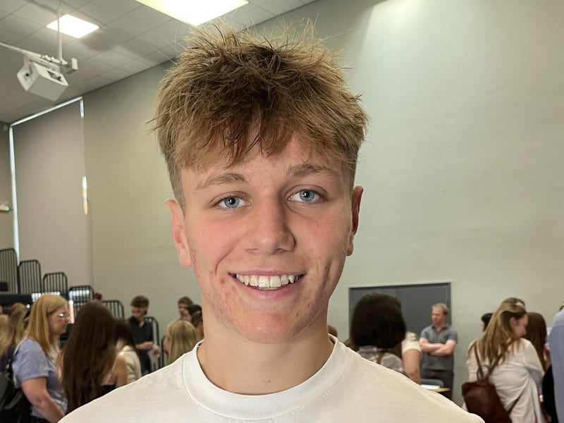 Charlie Wilson collecting his results at Prince William School in Oundle