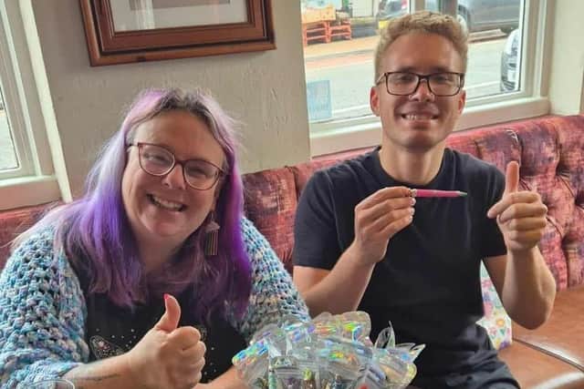 Tammy with our volunteer Sylvester, showing off some of the makes for the two thrift shops in The Cannon, Wellingborough and Revive, Desborough.