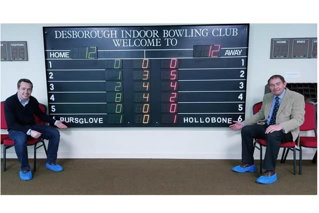l-r Tom Pursglove MP and Philip Hollobone MP reveal their scores/Desborough Indoor Bowling Club