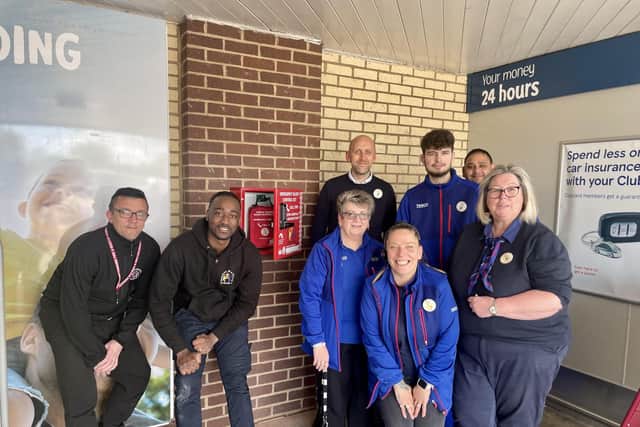Members of Off The Streets NN CIC with Tesco staff