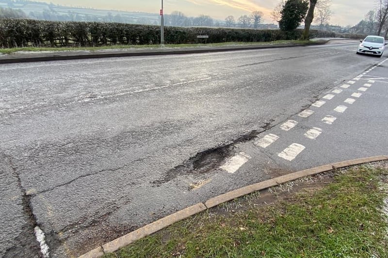 Apparently this pothole at the bottom of Weekley Glebe Road where it joins Stamford Road is coming up to its first birthday