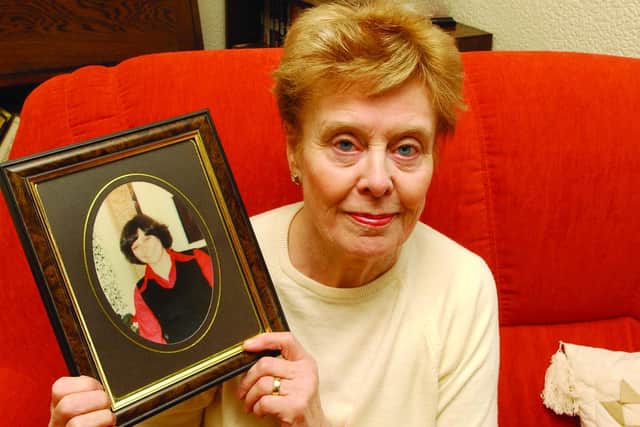 Beryl Leach with a photo of her daughter Barbara  - March 2004