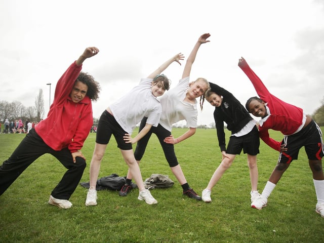 Danesholme Junior School pupils Jacob Morris, Morgan Brown, Bailee Mackmess, Emily Sawyer and Felicity Sibanda warm up for an inter-school cross country running competition at West Glebe Sports Pavillion in Corby.