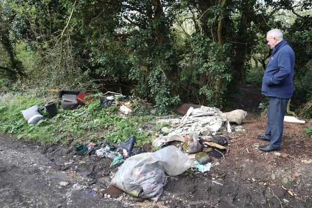 Martin Griffiths in Hill Side - a disused loop of the A509 in Little Harrowden with fly-tipped rubbish/National World