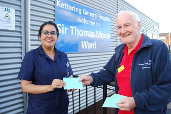Ward Sister Anu George receives a card from volunteer Jimmy Murray