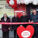 Peter Bone cuts the ribbon to the Post Office