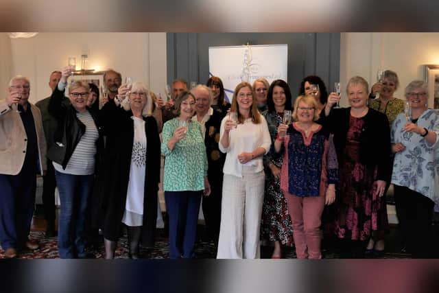 Staff celebrate the firm's 20th anniversary.