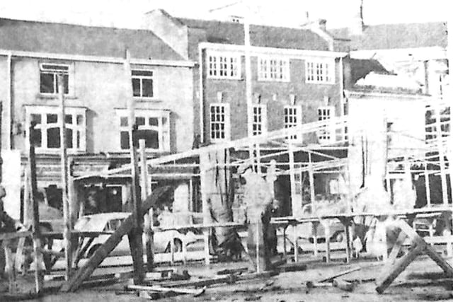 Wooden market stalls are dismantled in Kettering market place Every Picture Tells a Story by Dave Clemo