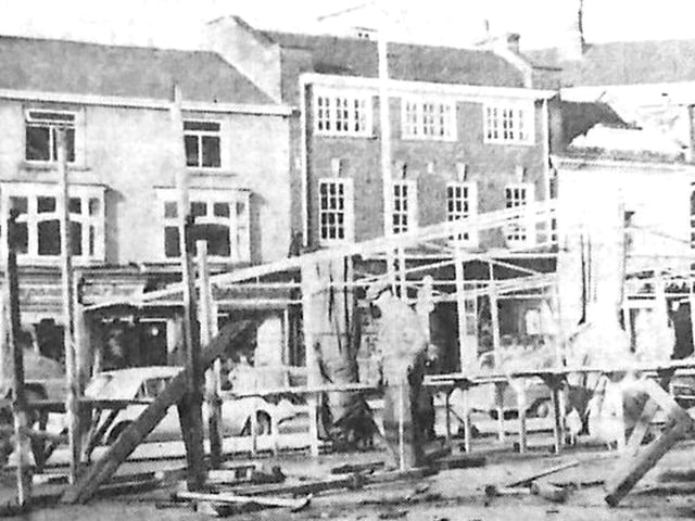 Wooden market stalls are dismantled in Kettering market place Every Picture Tells a Story by Dave Clemo