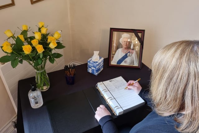 Emma Robinson writes in the book of condolence in Wellingborough's Swanspool council offices