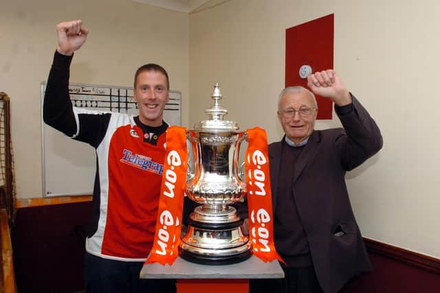 Back in 2009 - Poppies fans Mel Ridley and George Ridley have their photo taken with the cup /National World