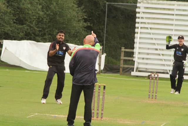 The finger goes up to give Mohammed Danyaal one of his four wickets