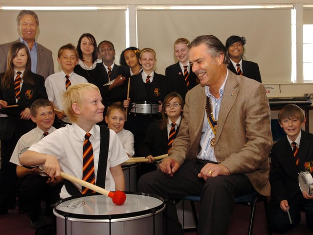 Wellingborough Rotary club donated a samba drum kit to the school. Student David Naylor demonstrates to club president John Patrick, May 2010