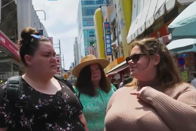 Sue (in the middle) visit a Japanese market with fellow contestants in Around the World in 80 Weighs /Channel 4