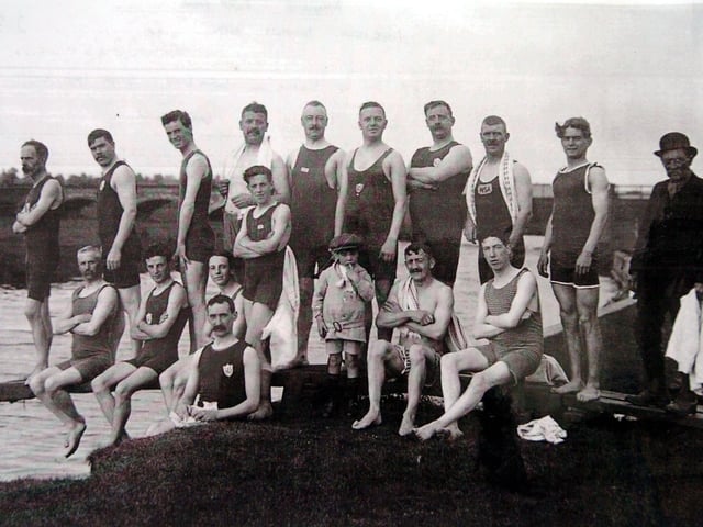 Members of the Wellingborough Swimming Club C1900 pose on the diving board by the River Nene at the Embankment