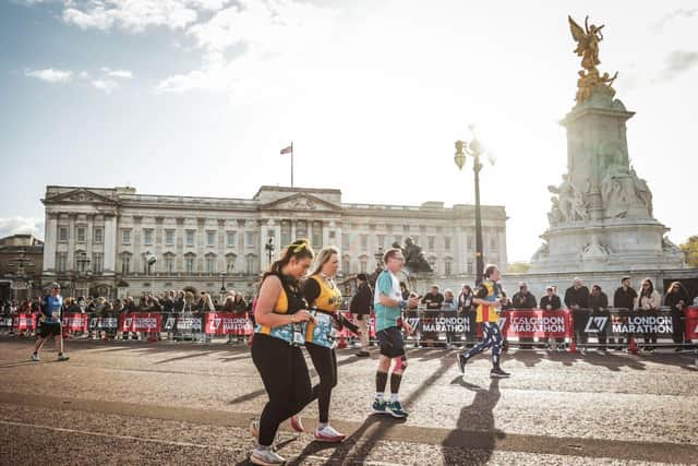 BN - 350302926 - Alyse and Alison running past Buckingham Palace