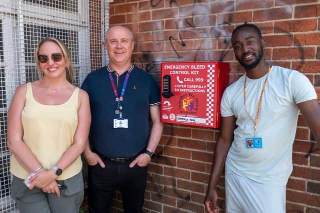 Commissioner Stephen Mold with Off the Streets NN founders Jane Capp and Rav Jones alongside one of the new bleed cabinets just installed in Eastfield Park, Wellingborough
