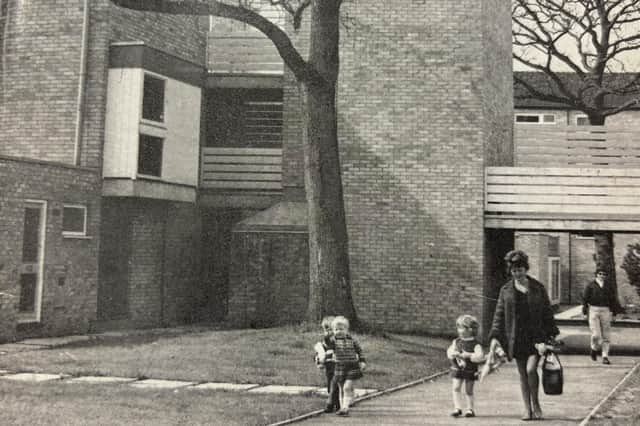 A woman and her children stroll through Lincoln Way during the 1970s.