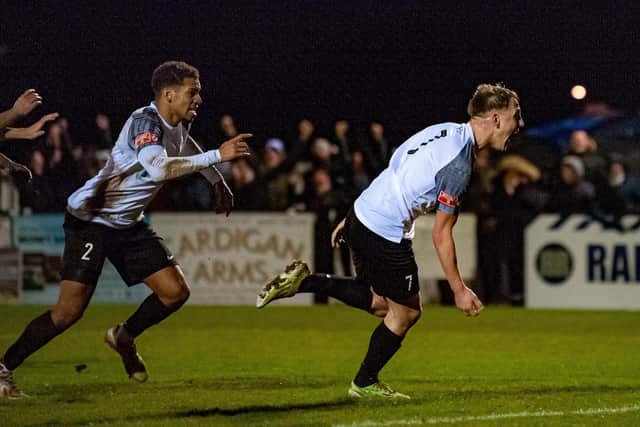 Cain Noble heads off to celebrate after he hit the only goal of the game in Corby Town's 1-0 win over Spalding United at Steel Park. Pictures by Jim Darrah