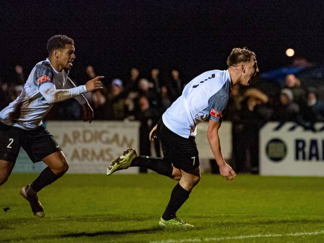 Cain Noble heads off to celebrate after he hit the only goal of the game in Corby Town's 1-0 win over Spalding United at Steel Park. Pictures by Jim Darrah