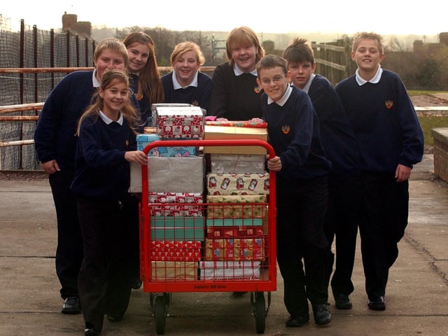Santa's little helpers arrive with Christmas boxes, November 2006. From left, Samantha Szolga, 11, Sam McCoy, 13, Josephine Ashpole, 12, April Robson, 14, Kirsty Muggleton, 15, Ryan McPolin, 12, Tom Wegener, 12, and Dean Spreadbury, 12