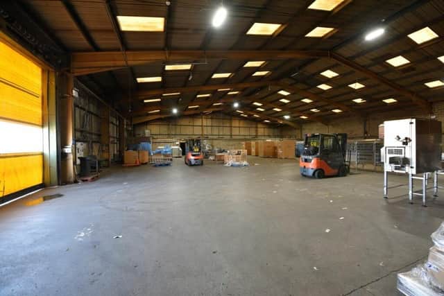 Forklifts are still parked where they were left when the firm closed