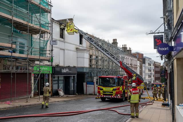 Police and fire crews remain on the scene of the Balloon Bar fire