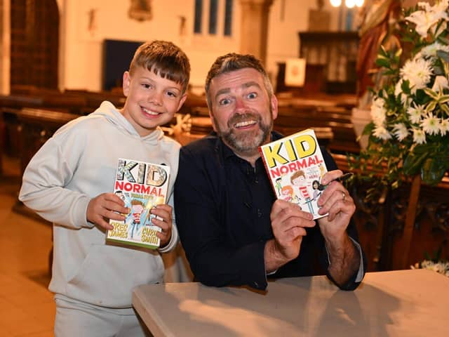 Hayden Smith age 9, with author Chris Smith who signed copies of his 'Kids normal books' for him