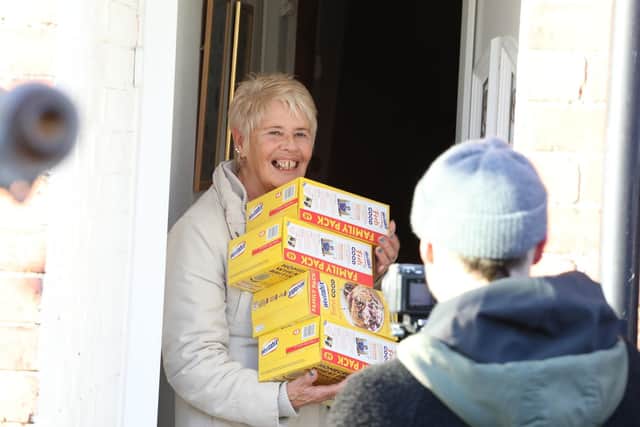 Filming - Diana Lee with some of the boxes of Weetabix/National World