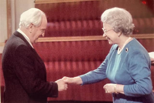Dr Trevor Hopkins receives his OBE from The Queen