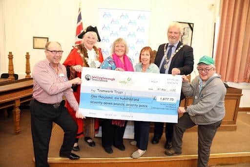 Cllr Lora Lawman presents her cheque to the Teamwork Trust