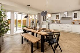 BN - The kitchen and dining area inside the Holden show home at Priors Hall Park