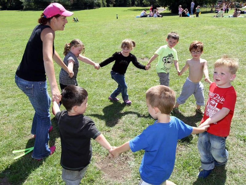 Donna Graham, playing with some of the children at a 2010 fun day.