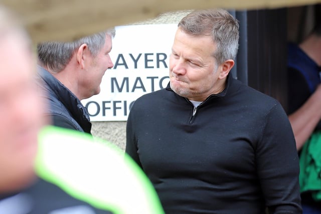 Former Poppies boss Mark Cooper talks things over with current manager Lee Glover