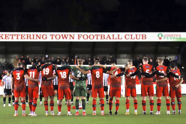 Kettering Town marked Remembrance Weekend with a minute's silence ahead of their 2-0 win over Hereford at Latimer Park on Tuesday night. Picture by Peter Short