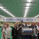 Former club president John Marlow hands over a cheque for £1325 to Prostate Cancer UK