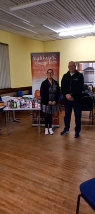 Consultant Sharon Wright with some of the donations for the food bank from her Slimming World members